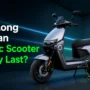 Electric scooter battery life explained with EV charging station and modern EV scooter for long-lasting performance.