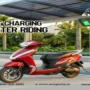 EV Sports electric scooter charging at a smart EV charging station with solar panels, showcasing intelligent charging technology for efficient and sustainable urban mobility.